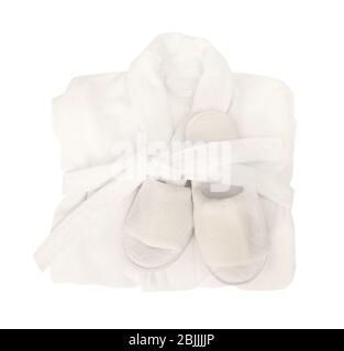 Folded bathrobe and bathing slippers on white background Stock Photo