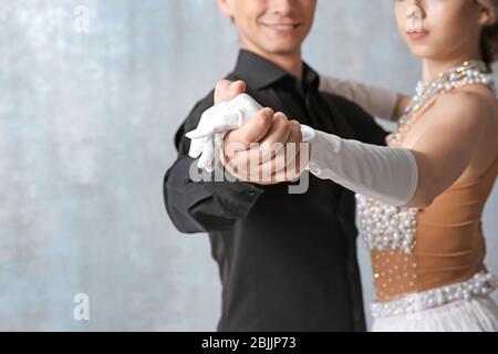 Couple of young dancers on color background Stock Photo
