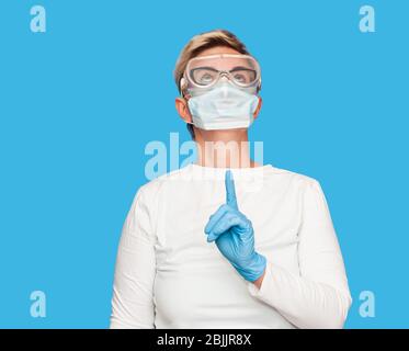 medical worker is wearing protective mask against coronavirus. Stock Photo