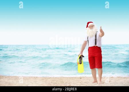 Authentic Santa Claus on beach Stock Photo