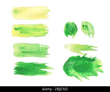 Green watercolor paint brushstrokes, isolated on white Stock Photo