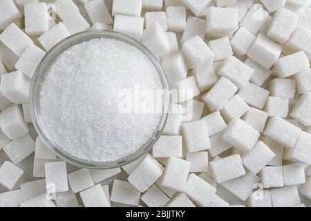 Granulated sugar in jar on sugar cubes Stock Photo