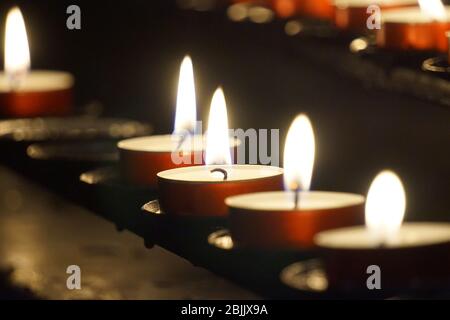 Burning small candles - religion concept Stock Photo