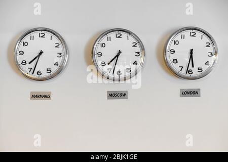 Modern wall clocks showing different time zones of world cities. 3D ...