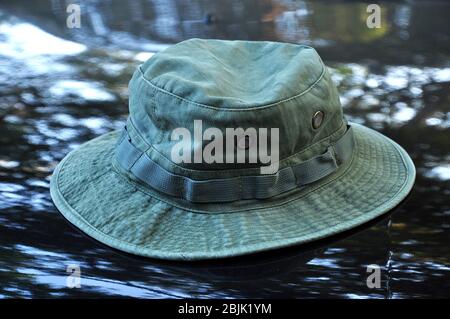 Green military boonie hat on black background. Stock Photo