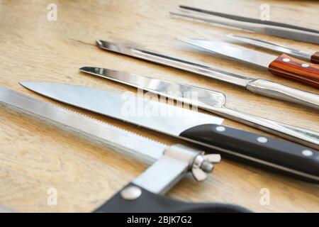 Set of knives on wooden background Stock Photo