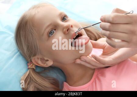 Cute girl at speech therapist's office Stock Photo