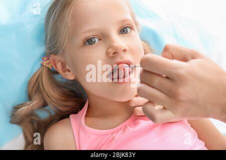 Cute girl at speech therapist's office Stock Photo