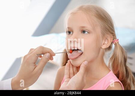 Cute girl at speech therapist's office Stock Photo