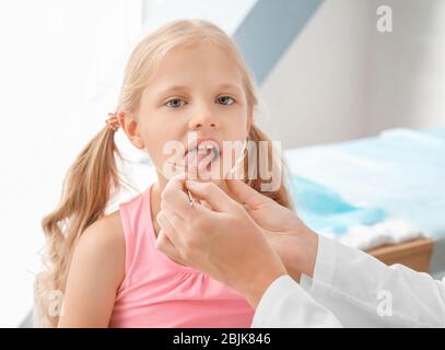 Cute girl at speech therapist's office Stock Photo