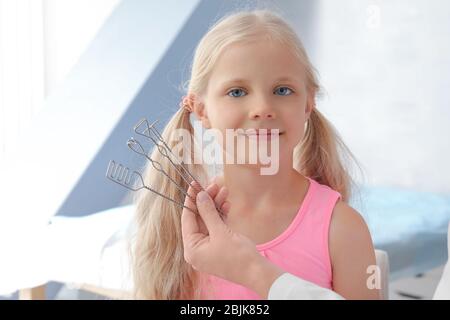 Cute girl at speech therapist's office Stock Photo