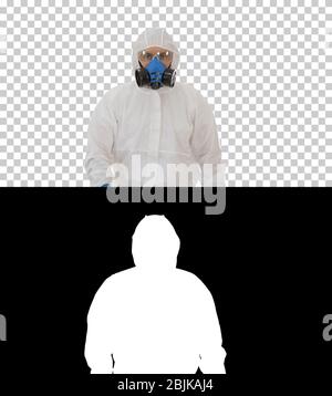 Man wearing hazmat suit walking, Alpha Channel Stock Photo