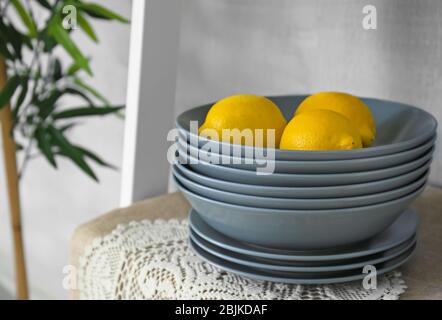 Grey bowls and plates on shelf Stock Photo