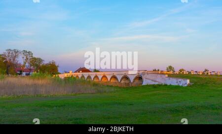 The famous nine hole bridge at sunset Hortobagy, Hungary Stock Photo