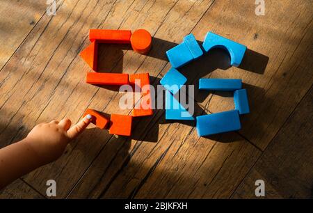 5G network. Kid's hand puts out the sign from wooden cubes. Global telecommunication development. Stock Photo