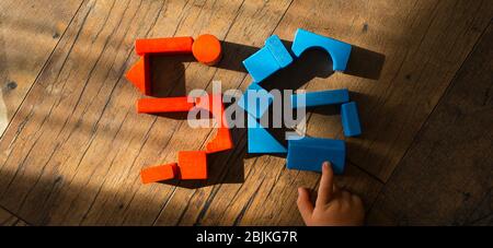 5G network. Kid's hand puts out the sign from wooden cubes. Global telecommunication development. Stock Photo