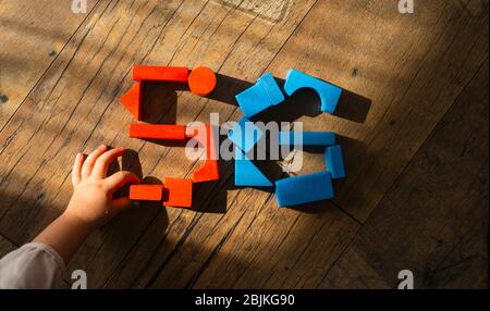5G network. Kid's hand puts out the sign from wooden cubes. Global telecommunication development. Stock Photo