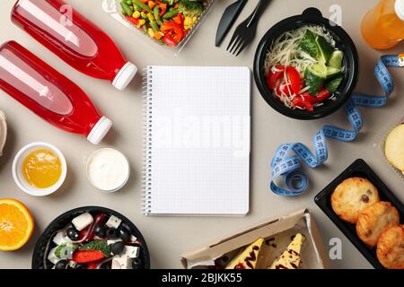 Food delivery. Food in takeaway boxes on gray background Stock Photo