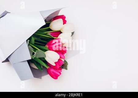 Spring flowers isolated on white background. Women's day. Bouquet of white and pink tulips. Present for Mother's day. Stock Photo