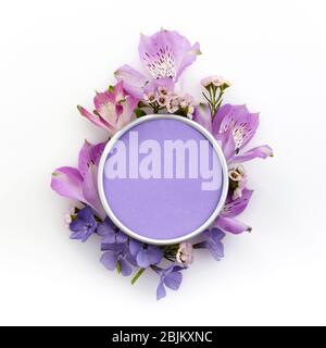 Frame made with various colorful flowers on white background with copyspace for text. Tlat lay. Top view Stock Photo