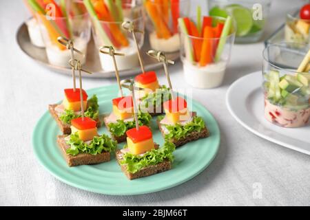 Delicious canapes for baby shower on plate Stock Photo