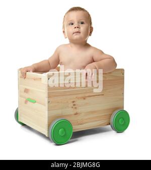 Cute little baby in wooden cart, isolated on white Stock Photo