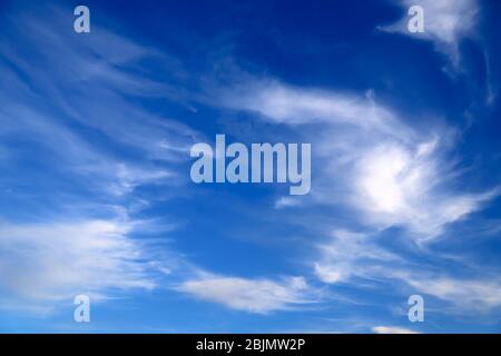 Blue sky landscape background for poster. Picturesque beautiful cirrus clouds create unusual patterns in the sky. Cloudy weather in spring and summer. Stock Photo