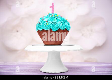 First birthday cake with candle on table Stock Photo