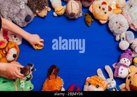 children's soft toys for developing games on a blue background Stock Photo