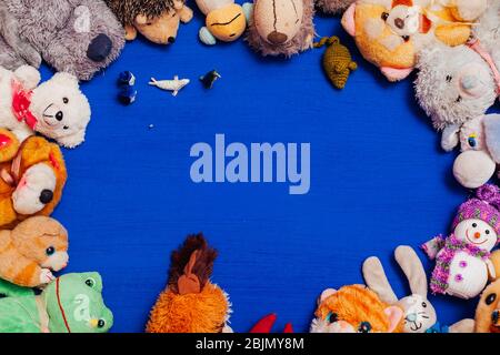 children's soft toys for developing games on a blue background Stock Photo