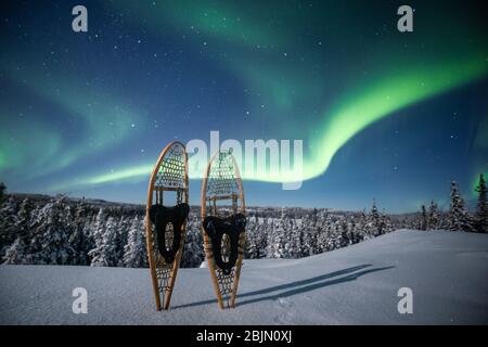 Snowshoes below northern lights, Yellowknife, Northwest Territories, Canada, North America Stock Photo
