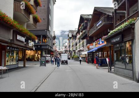 Zermatt, Switzerland - September 28, 2019: Mountain resort in the Swiss Alps. Crowded streets of Zermatt. Stock Photo