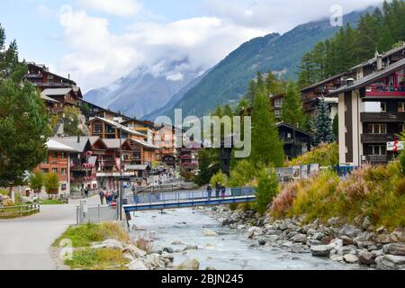 Zermatt, Switzerland - September 28, 2019: Mountain resort in the Swiss Alps. Crowded streets of Zermatt. Stock Photo
