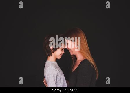 Portrait of a mother standing face to face with her son Stock Photo