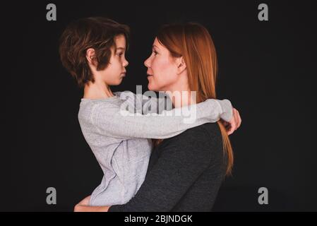 Portrait of a mother hugging her son Stock Photo