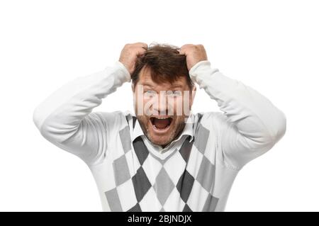 Man in sweater pulling his hair on white background Stock Photo