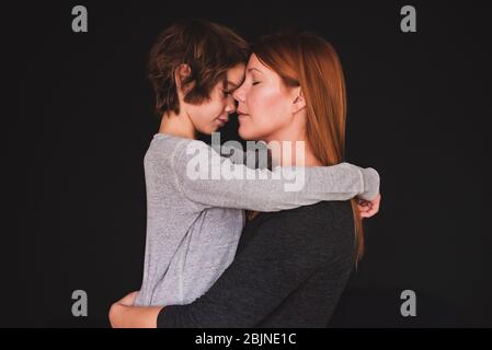Portrait of a mother hugging her son Stock Photo
