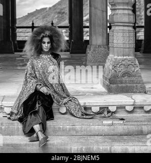 Jaipur, Rajasthan / India - September 28, 2019: Beautiful girl in traditional Indian clothing at the royal palace in the Amer Fort in Jaipur, India Stock Photo