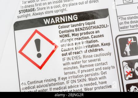 ASDA laundry soap liquid & Exclamation mark hazard symbol for skin, eye or respiratory tract irritant on warning label. Dangerous household products. Stock Photo