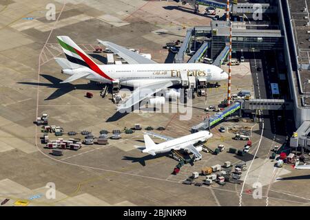 , terminals on the premises of the airport with aircraft Airbus Emirates A380 in Duesseldorf, 17.08.2016, aerial view, Germany, North Rhine-Westphalia, Lower Rhine, Dusseldorf Stock Photo