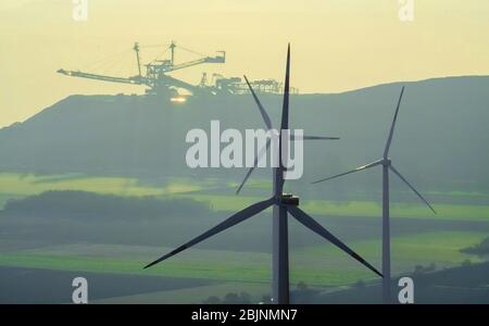 Wind turbine windmills in Titz-Bettenhoven, in the background the brown coal mine opencast mine Hambach-Etzweiler of RWE Power AG, 29.11.2016, aerial view, Germany, North Rhine-Westphalia, Bettenhoven, Titz Stock Photo