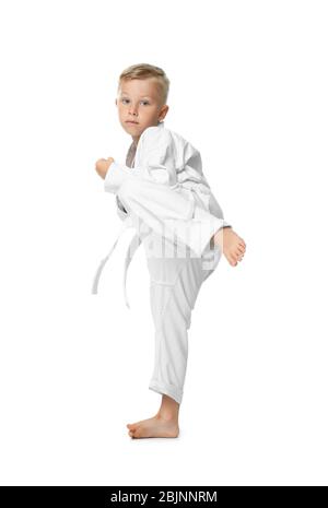Little boy practicing karate on white background Stock Photo