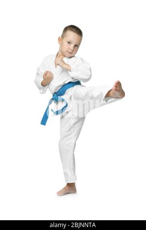 Little boy practicing karate on white background Stock Photo