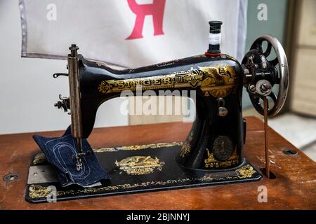 Vintage black and gold Singer sewing machine. Stock Photo