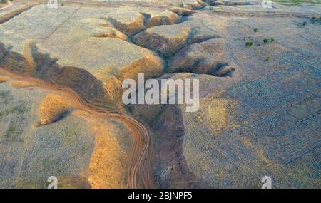 Soil erosion in the steppe zone of the Caspian lowland. Aerial view. Stock Photo