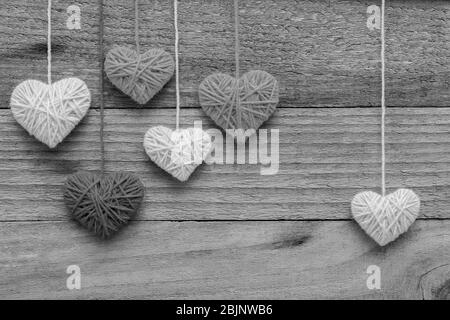heart shape made from knitting wool on old shabby wooden background, Image of Valentine's day Stock Photo