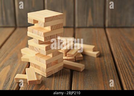 Tower made from wooden blocks on table Stock Photo