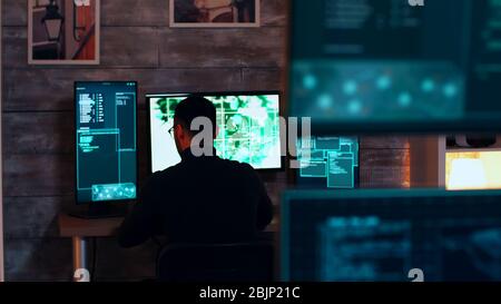 Team of organised cyber criminals hacking the government main server. Stock Photo