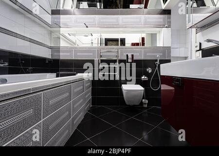 Interior of a modern bright bathroom with a sink and toilet Stock Photo