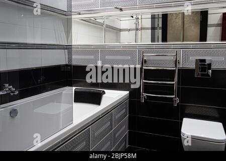 Interior of a modern bright bathroom with a sink and toilet Stock Photo